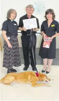  ??  ?? Paul Ledger and Yorick who have been visiting people on the wards at Maidstone Hospital. Right: The duo with Reverend Nicola Mitra and chief nurse Claire O’Brien