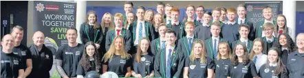  ??  ?? Accolade Paul Elliott (extreme left) with firefighte­rs and pupils from Balfron High following the signing of the 8000th donor recruited to the trust following its link with Scottish Fire and Rescue