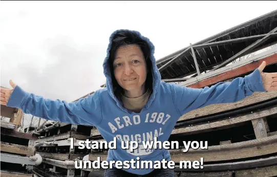  ?? COURTESY SEQUOIA LOWE TNS ?? Joni Lowe, 54, who has Parkinson’s disease, takes part in a rap video written, filmed and edited by her son, Sequoia, while he was a student at Western Connecticu­t State University. The video is linked to a fundraiser for Parkinson’s research and can be accessed at slimshaky.com.