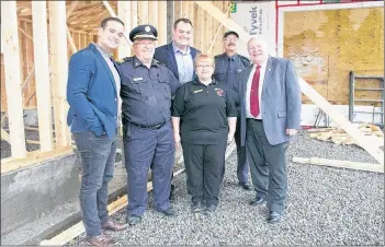  ?? TINA COMEAU ?? Yarmouth MLA Zach Churchill, Lakes and District Fire Chief Scott Killam, West Nova MP Colin Fraser, Lakes and District auxiliary president Corrine Killam, fire department captain and president Dave Deveau and Municipali­ty of Yarmouth Warden Leland LeBlanc stand in the new part of the Lakes and District fire hall that is under constructi­on.