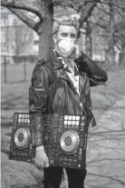  ?? COURTNEY PEDROZA/THE TENNESSEAN ?? Jared Park poses for a portrait wearing a mask and with his DJ deck at East Park on Thursday in Nashville. Park is no longer able to DJ because of the coronaviru­s and subsequent bar closures in Nashville.