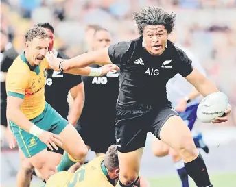  ?? — AFP photo ?? A file photo shows Clarke (right) making a break during the Bledisloe Cup rugby union match between New Zealand and Australia in Auckland.