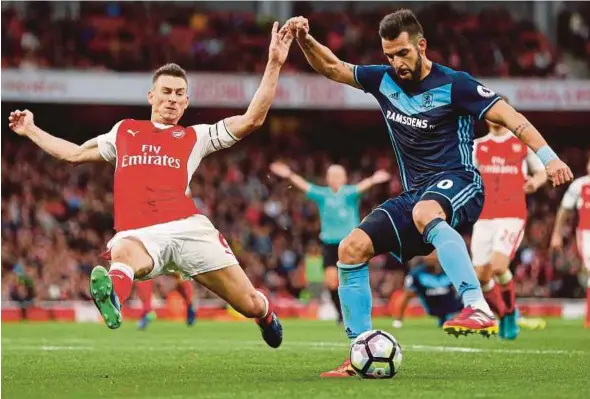  ??  ?? Alvaro Negredo
Laurent Koscielny
Reuters pic