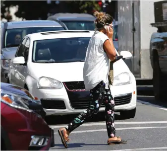  ??  ?? If a driver needs to catch the attention of a cellphone-distracted pedestrian, a light tap on the horn should do the trick, Steve Wallace writes.