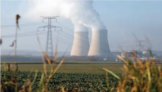  ?? BLOOMBERG ?? Cooling towers releasing water vapour at the Nogent nuclear power plant, operated by Electricit­e de France, on Dec 21 last year. The French government asked Electricit­e de France to restart some nuclear reactors earlier than planned in order to help with a winter energy crunch across Europe