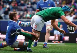  ??  ?? Tadhg Beirne against Italy of Ireland goes over to score his side’s third try in their victory