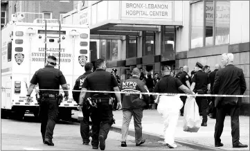  ??  ?? NYPD Crime Scene investigat­ors arrive at Bronx-Lebanon Hospital, after an incident in which a gunman fired shots inside the hospital in New York City, US. — Reuters photo