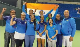  ??  ?? The Indian Fed Cup team members celebrate after their win in Dubai on Sunday.