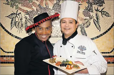  ?? PHOTOGRAPH: DONNA VAN DER WATT ?? BAY OLÉ: Bayside Pantry waiter Siphelo Petu, left, and the Boardwalk casino’s executive head chef, Daya Naidoo, with some Spanish tapa treats