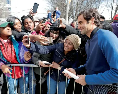  ?? — AP ?? Roger Federer poses for a selfie after promoting the Laver Cup tennis tournament in Chicago on Monday.