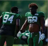  ?? John Jones / Icon Sportswire via Getty Images ?? Jets DE Carl Lawson (58) takes a break during training camp last year.