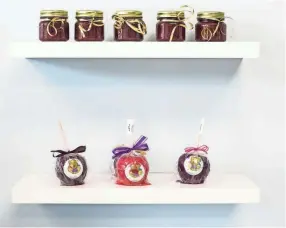  ??  ?? Fruit jams and candy apples are on display inside of Jaybear Bake Shop in the Stage Coach Collection III shopping center. Sisters Courtni Johnson and Jami Harbin have opened Jaybear Bake Shop. BRAD VEST / THE COMMERCIAL APPEAL