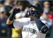  ?? TED S. WARREN — THE ASSOCIATED PRESS ?? Seattle Mariners’ Nelson Cruz looks up as he crosses the plate after hitting a two-run home run against the Indians Saturday in Seattle.