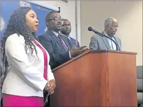  ?? [NURIA MARTINEZ-KEEL/ THE OKLAHOMAN] ?? Oklahoma City School Board member Charles Henry speaks at a news conference Friday at the state Capitol. Rep. Jason Lowe, second from right, hosted the press conference with Henry and Northeast Academy alumni, including Rep. Ajay Pittman, left, who graduated from the school in 2012.