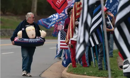  ?? Photograph: Chris Kleponis/EPA ?? Raymond Deskins wears an inflatable toy supporting Donald Trump at a protest outside Trump National Golf Club, in Sterling, Virginia, on Saturday.