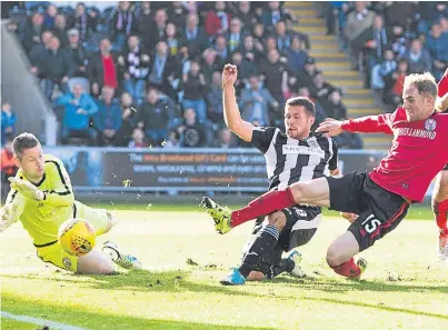  ?? Picture: SNS Group. ?? Dale Hilson slides in ahead of Brechin defender Euan Spark to squeeze a shot past goalkeeper Graeme Smith for St Mirren’s winning goal.
