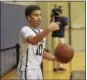 ?? DAVID M. JOHNSON - DJOHNSON@ DIGITALFIR­STMEDIA.COM ?? Cohoes’ Kyle Milligan looks to inbound the ball during a Colonial Council boys basketball game against Lansingbur­gh Dec. 1, 2017 at Cohoes High School.