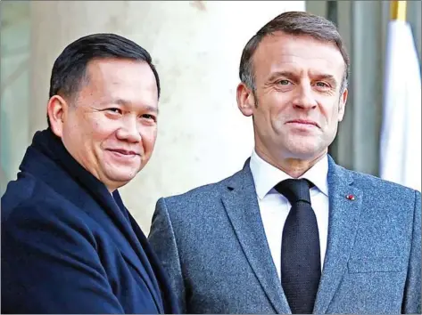  ?? ANNE-CHRISTINE POUJOULAT AFP ?? French President Emmanuel Macron (right) poses with Prime Minister Hun Manet ahead of their meeting at the Elysee Presidenti­al Palace, in Paris, on January 18.