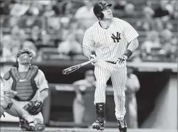  ?? Frank Franklin II
Associated Press ?? MARK TEIXEIRA hits a two-run homer in the third for the Yankees, who almost let an 8-1 lead get away.