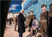  ?? ?? Biden visits the Wall of Remembranc­e, a memorial to Ukraine’s fallen soldiers, during his five-hour stop Monday in Kyiv.