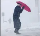  ?? The Associated Press ?? Cherie Burke contends with blowing snow during Tuesday in Portland, Maine.