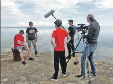  ??  ?? James Smith and Andy McNamara as the hapless Fraser and Scott on the Corrie jetty with the film crew.