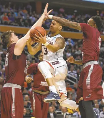  ?? KEVIN HOFFMAN, USA TODAY SPORTS ?? As he has most of this season, Shabazz Napier was the driving force for Connecticu­t’s comefrom-behind overtime victory against Saint Joseph’s. Napier had 24 points and six assists.