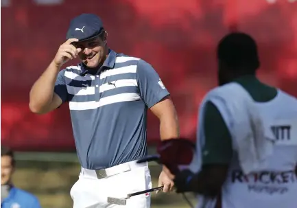  ?? Carlos Osorio, The Associated Press ?? Bryson DeChambeau smiles after his birdie putt on the 18th green during the final round of the Rocket Mortgage Classic golf tournament, Sunday at Detroit Golf Club.