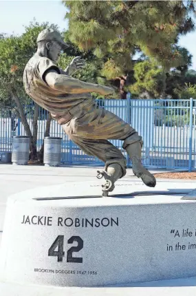  ?? KIRBY LEE/USA TODAY SPORTS ?? A Jackie Robinson statue sits in the center field plaza at Dodger Stadium.