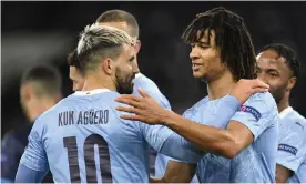  ?? Photograph: Peter Powell/EPA ?? Sergio Agüero of Manchester City (left) celebrates with Nathan Aké after scoring the second goal of the night.