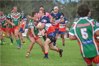  ??  ?? BIG TACKLE: Warwick Cowboys winger Dan Watson on the attack in a 24-10 loss to Pittsworth at Father Ranger Oval. PHOTO: GERARD WALSH