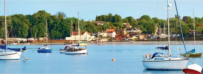  ??  ?? Ahoy there! Suffolk’s idyllic coast. Right: Will Coney, seven, is thrilled with nautical life, as depicted in the Swallows And Amazons books