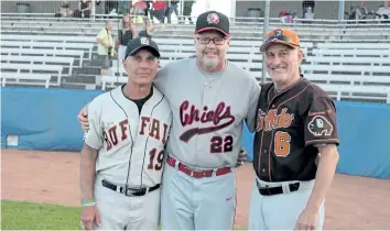  ?? SUPPLIED PHOTO ?? Welland Chiefs head coach Larry Stephens, centre, and Erie Buffalo head coach Ralph Proulx, left, pose with another Buffalo senior men’s baseball coach during the annual all-star game in July. The liaison made between the leagues from different nations...