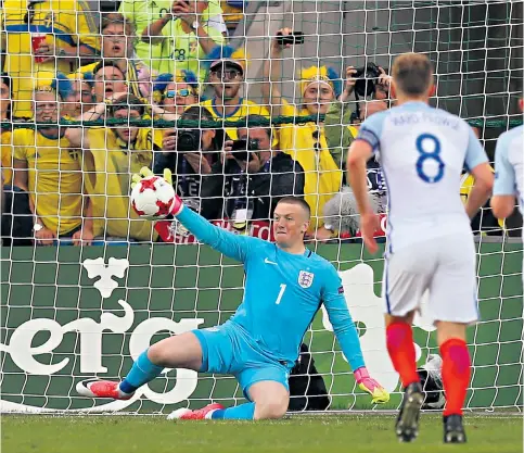  ??  ?? Proving his worth: Jordan Pickford’s save keeps England Under-21s at the Euros