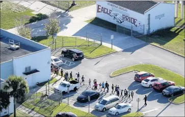  ?? Mike Stocker Sun Sentinel ?? THE ALLEGATION­S may add to the list of failures surroundin­g the school shooting Feb. 14 in Parkland, Fla.