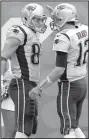  ?? AP/BILL KOSTROUN ?? New England Patriots teammates Tom Brady (12) and Rob Gronkowski (87) celebrate after the two connected for a touchdown during the second half Sunday.