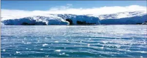  ?? MATHILDE BELLENGER/AFP ?? Blocks of ice drift on the water off the coast of a glacier on King George Island, Antarctica, on February 1.