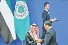  ?? — Reuters photo ?? Chinese President Xi Jinping and Saudi Arabia’s Foreign Minister Adel bin Ahmed Al-Jubeir shake hands at a China Arab forum at the Great Hall of the People in Beijing, China, July 10.