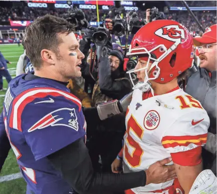  ?? PAUL RUTHERFORD/USA TODAY SPORTS ?? Former Patriots quarterbac­k Tom Brady (12) and Chiefs quarterbac­k Patrick Mahomes (15) after a game at Gillette Stadium.