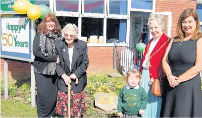  ??  ?? ●● Celebratin­g Ivy Bank School’s 50th birthday are, from left: Sheila Whitaker, her mum Mrs Whitaker, Mayor of Cheshire East, Coun Hilda Gaddum, Valerie Whitaker, and the school’s youngest pupil, Ava