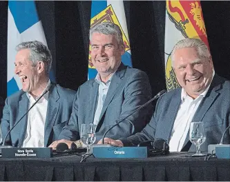  ?? ANDREW VAUGHAN THE CANADIAN PRESS ?? Manitoba Premier Brian Pallister, left, N.S. Premier Stephen McNeil and Ontario Premier Doug Ford at Friday’s closing news conference of the Canadian premiers’ meeting in St. Andrews, N.B.