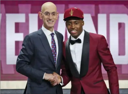  ?? KEVIN HAGEN — ASSOCIATED PRESS ?? Alabama’s Collin Sexton, right, poses with NBA Commission­er Adam Silver after he was picked eighth overall by the Cavaliers during the first round of the NBA draft June 21 in New York.
