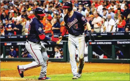  ?? The Houston Chronicle/tns ?? Washington Nationals left fielder Juan Soto (22) and Washington Nationals shortstop Trea Turner (7) celebrate during the seventh inning of Game 2 of the World Series at Minute Maid Park in Houston on Wednesday.