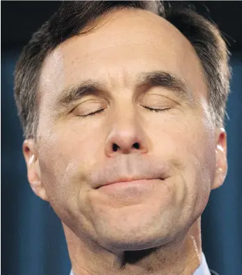  ?? ADRIAN WYLD/THE CANADIAN PRESS ?? Minister of Finance Bill Morneau says he will set up a blind trust and sell off his shares in his family’s pension services company.