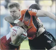  ?? PICTURE: SIMON HULME ?? UPSTARTS: Michael Shenton and Castleford Tigers will look to continue their fine start at champions Wigan tonight.