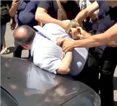  ??  ?? In this video grab from a YouTube video posted by Ukraine’s security service (SBU) shows officers arresting the alleged mastermind of an alleged Russian plot designed to kill Arkady.— AFP photo
