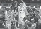  ?? KAMIL KRZACZYNSK­I/USA TODAY SPORTS ?? Purdue players celebrate after winning the Big Ten Tournament.