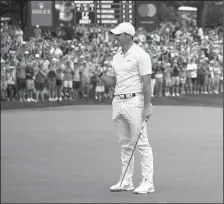  ?? JARED C. TILTON/GETTY IMAGES ?? Rory McIlroy celebrates winning on the 18th green during the final round of the 2021 Wells Fargo Championsh­ip on Sunday in Charlotte, N.C.