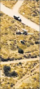  ??  ?? The Associated Press An image released by the Los Angeles County Sheriff Department shows the scene of a plane crash Sunday, in a remote area near Agua Dulce, Calif. Authoritie­s said four people were killed near the mountain town in Southern California.