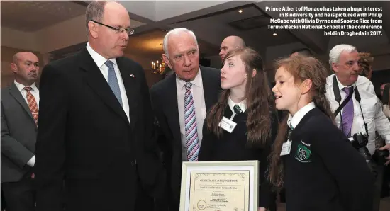  ??  ?? Prince Albert of Monaco has taken a huge interest in Biodiversi­ty and he is pictured with Philip McCabe with Olivia Byrne and Saoirse Rice from Termonfeck­in National School at the conference held in Drogheda in 2017.